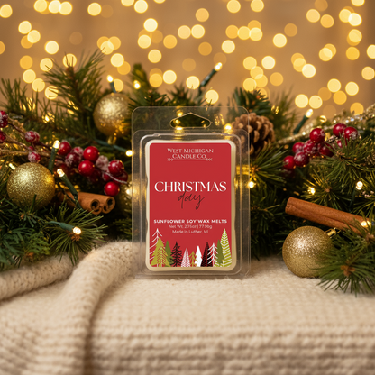 Christmas Day wax melts styled on a cozy winter table with holiday decor