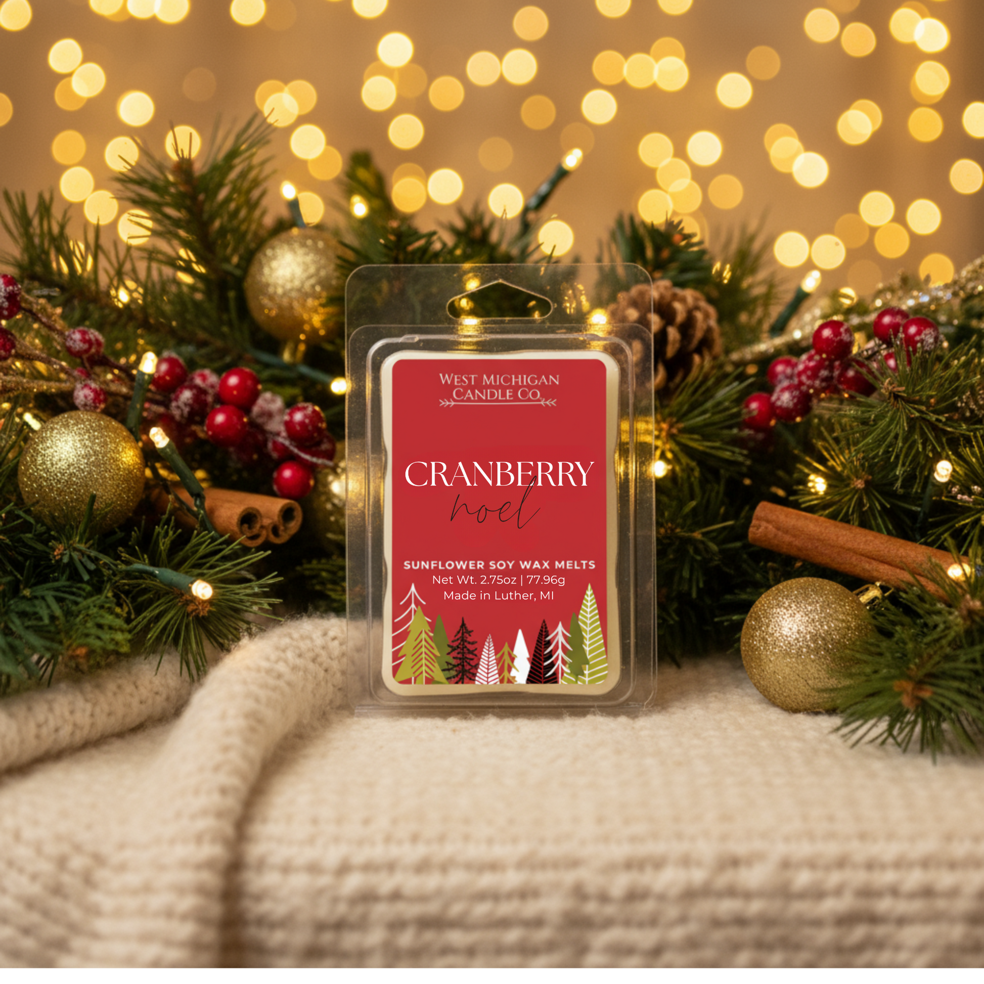 Cranberry Noel wax melts styled on a cozy winter table with holiday decor