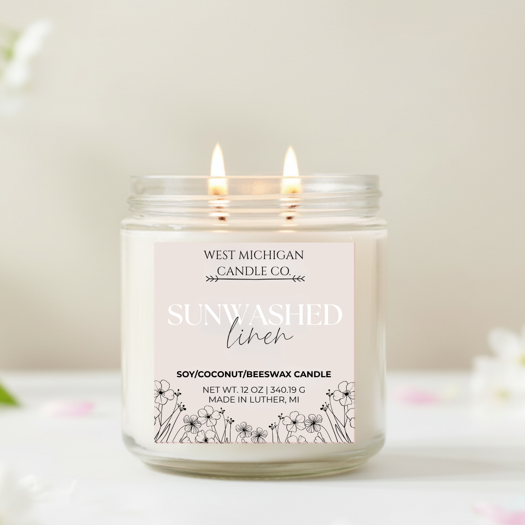 Double-wicked candle with 'Sunwashed Linen' scent on a light background