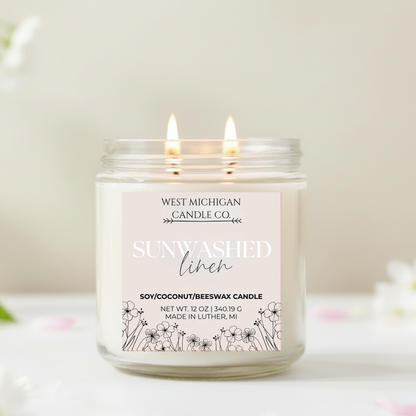 Double-wicked candle with 'Sunwashed Linen' scent on a light background